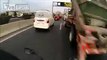 Crazy biker drives through traffic jam at high speed - Chile