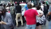 Drama queen pretends to be fainted to blame cops during riot