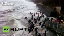 Russia: Watch people fight huge waves to get amber stones