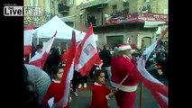 Arab-Christians parade through Haifa for Christmas (waving Israel and Vatican flags)