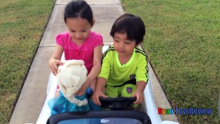 Kid Playing Outside riding car blowing bubbles with Giant Frozen Elsa Doll Ryan ToysReview