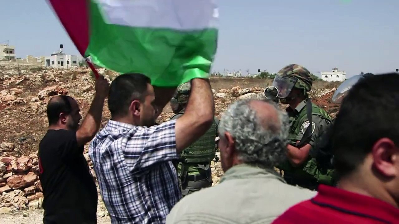 Activists demonstrate against settlements in the West Bank