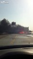 Trucks collide, burst into flames
