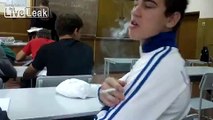 Shameless and impudent Ukrainian guy smokes in front of a teacher in the school