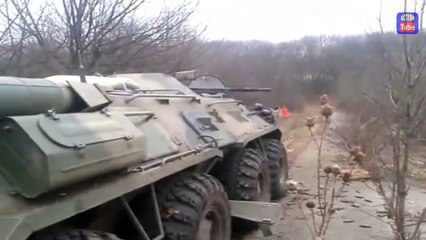 Novorossyia BTR-80 fire on Ukrainian army positions...