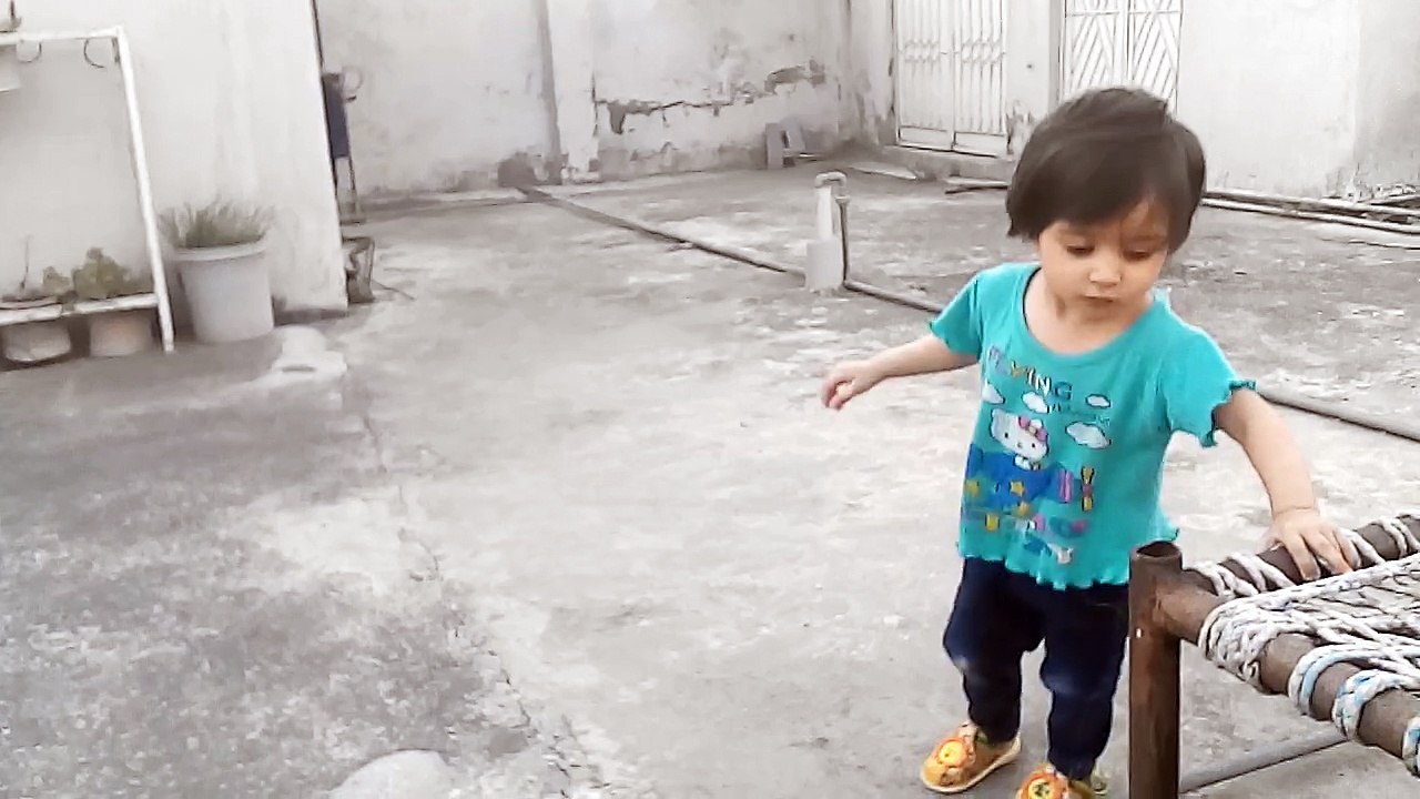 Abiha watching Pigeons on Roof