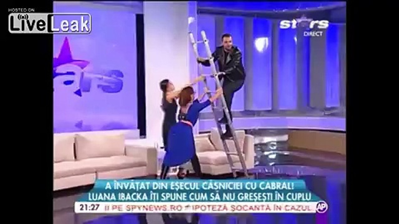 Romanian TV presenter falls off ladder live