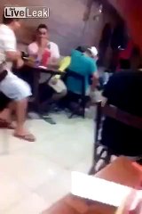 woman kisses her boyfriend while holding another man's penis