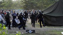 Migrants at Hungary border camp pelt police with stones