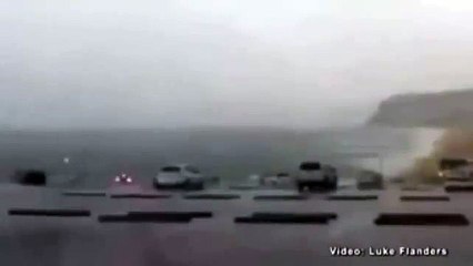 Surfer captures the moment a thunder bolt strikes a car