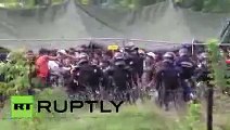 Riot police teargas refugees attempting to break out of detention camp in Hungary
