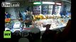 Crazy CCTV- Store clerk fights off robbers with water bottle