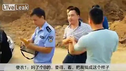 Woman gets shirt unbuttoned with breasts exposed when being restrained by police officers