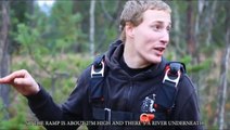 Finnish motocross rider jumps bike over trees into a river