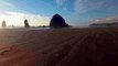 Haystack Rock in Cannon Beach Oregon - Drone Aerial Video at Sunset