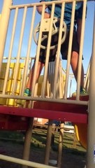 Kid fails at runing up a slide