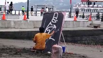 Street Artist Paints an Entire Portrait Upside-Down