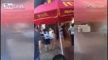 Women fight over two cups of milk in front of McDonald's