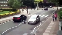 Pedestrian Tries To Beat Car Across Street Loses Race