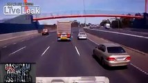 Careless Driver loses control, crashes and nearly gets cleaned up by truck.