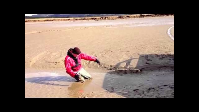 Man stuck in quicksand waiting for rescue