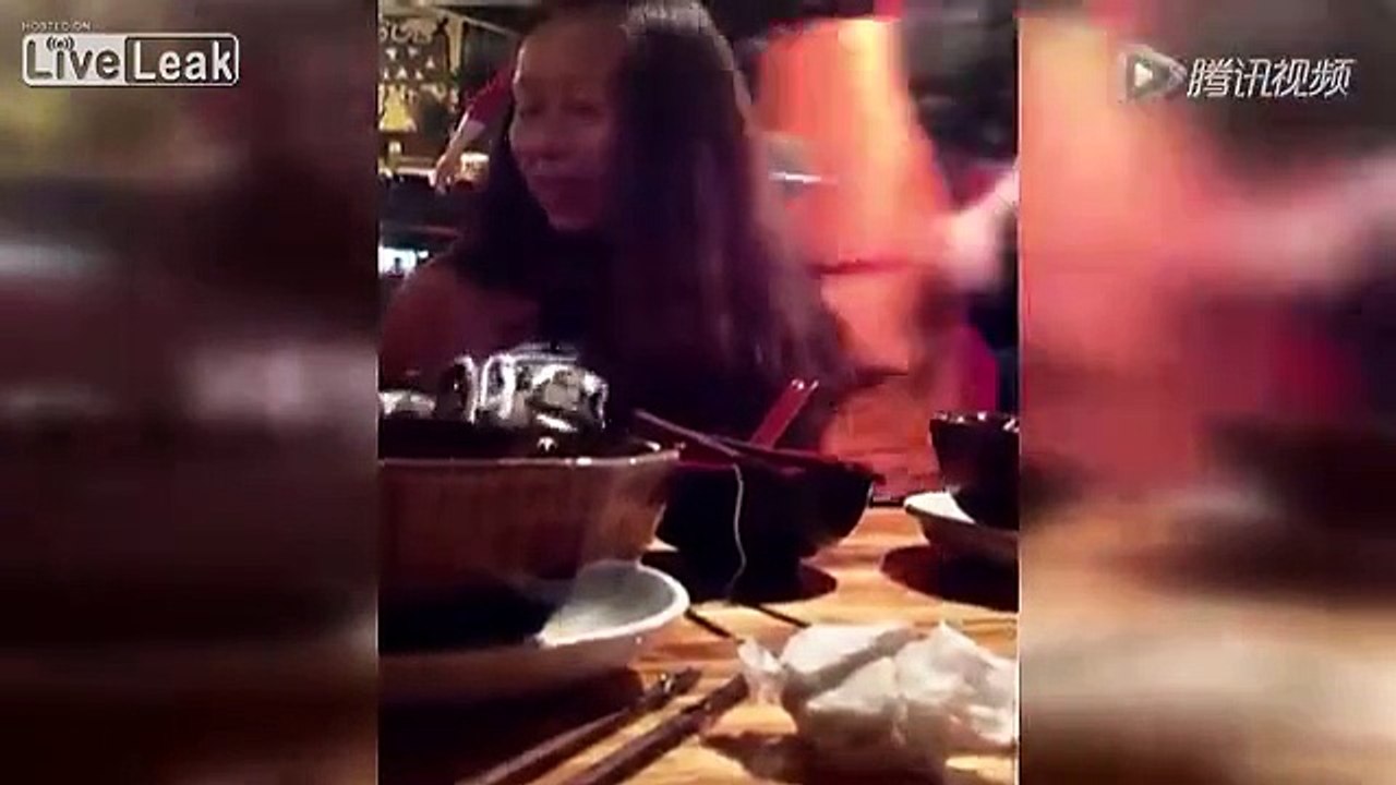Woman force feeds baby noodles
