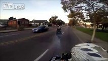 Insane motorcyclist plays chicken with on coming cars while doing smokey burnout