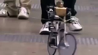robot riding bike