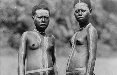 Excited Jarawa tribals jump on board the first boats of visiting anthropologists