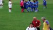 Female goalkeeper tries to attack referee and removes top
