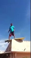 Download Video: Dumb guy surfing on a roof... Epic Fail