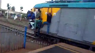 People hanging onto overloaded train in South Africa
