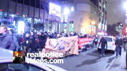 Protester giving the finger to the camera