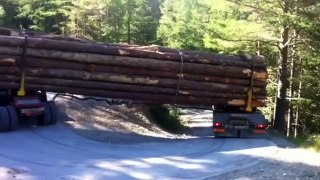 Logging Truck Passing a Hairpin Bend on Mountain Road