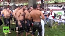 Turkey: Hunky wrestlers lube up and pin each other down