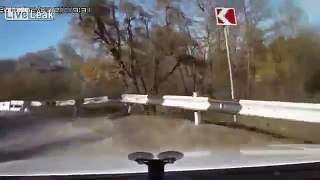 Russia. Guys crash into river and swim along like nothing happened