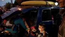 The end of the road: volunteers drive refugees from Hungary to Austria