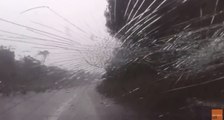 Impact of Violent Hail Shower Shatters Car's Windshield