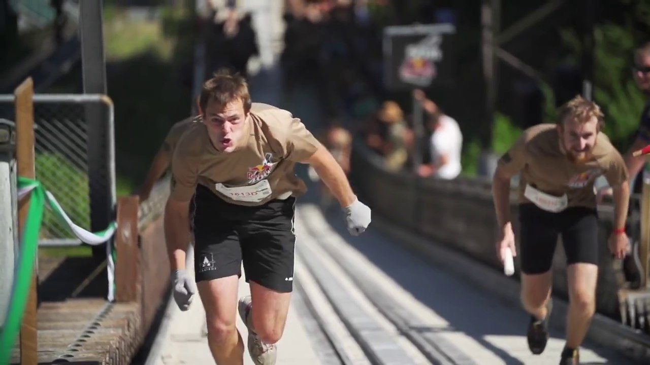 Aggressive Vertical Running Race Up a Ski Jump