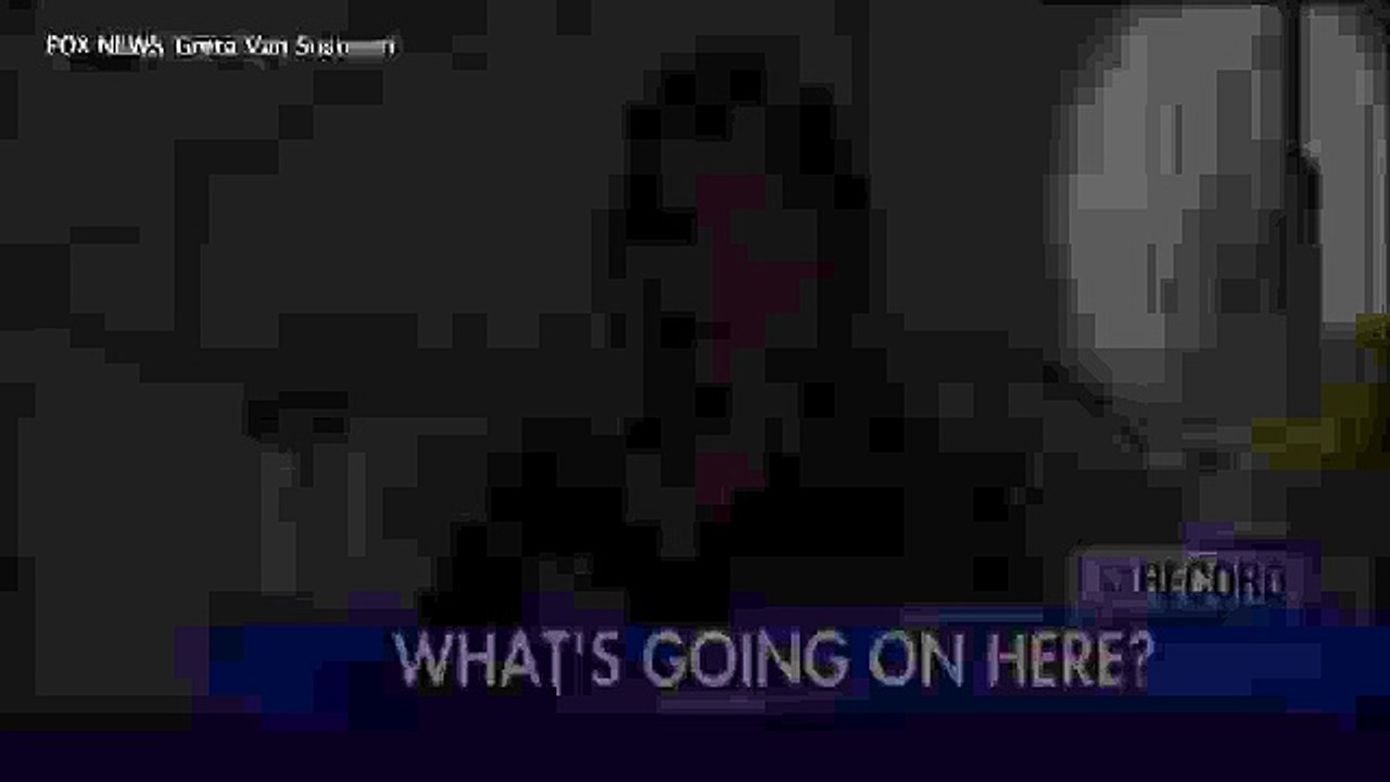 Bag hauled over prison wall during live news report