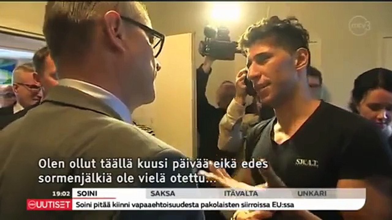 Only in Finland-Lying Shild-Terrorist-Refugee Sheaking Hand with Prime Minister?