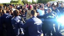 Hungarian police scuffle with migrants and refugees at Serbia border