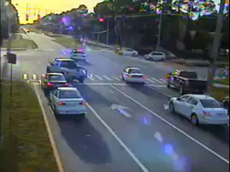 Traffic Camera Catches Mini Smart Car Slamming into Police Cruiser