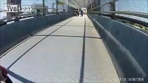 Car driving in bike lane on bridge collides with cyclist