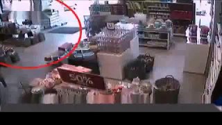 Woman Crashes Car Into A Shop