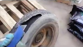 World's Dumbest Man Almost Kills Himself With A Tire