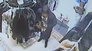 Woman caught stealing clothes by putting them in her pantihose CCTV footage
