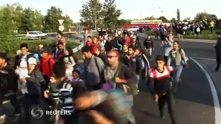 Hungarian police pepper spray migrants at border town