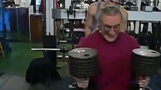 Robert Cheeke pressing 110's for chest workout