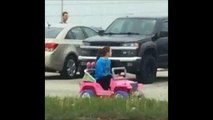 Student Tara Monroe drive her Barbie Jeep in Campus